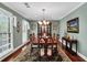 Formal dining room with hardwood floors, traditional furnishings, and a large window at 4702 Sequoia Sw Dr, Lilburn, GA 30047