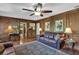 Spacious living room featuring hardwood floors, wood paneling, and natural light at 4702 Sequoia Sw Dr, Lilburn, GA 30047