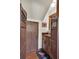 Small sink area with dark wood cabinets, unique doors and a colorful rug adds character to this space at 4702 Sequoia Sw Dr, Lilburn, GA 30047