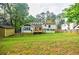 Backyard featuring a storage shed, a deck, and a full basketball court providing various outdoor options at 5105 Davidson Ne Rd, Marietta, GA 30068