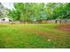 Large, well-maintained backyard enclosed by a wood fence, offering ample space for outdoor activities and privacy at 5105 Davidson Ne Rd, Marietta, GA 30068