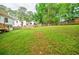 Spacious, fenced backyard with lush green grass, offering plenty of room for recreation and relaxation at 5105 Davidson Ne Rd, Marietta, GA 30068