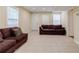 Spacious basement with neutral flooring, a comfortable sofa, and natural lighting at 5105 Davidson Ne Rd, Marietta, GA 30068