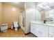 Bathroom features a toilet, shower, and white vanity with a sleek countertop at 5105 Davidson Ne Rd, Marietta, GA 30068