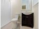A bathroom featuring a toilet, shower, and vanity with a sink at 5105 Davidson Ne Rd, Marietta, GA 30068