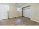 Cozy bedroom with light-colored wood flooring, a closet, and a window for natural light at 5105 Davidson Ne Rd, Marietta, GA 30068