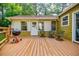 A wood deck with chairs and a grill at 5105 Davidson Ne Rd, Marietta, GA 30068