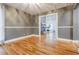 Neutral dining room features hardwood floors and views into bright living area with stone fireplace at 5105 Davidson Ne Rd, Marietta, GA 30068
