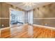 Spacious dining room with hardwood floors, neutral walls, and open view to living space at 5105 Davidson Ne Rd, Marietta, GA 30068