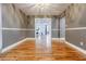 Neutral dining room features hardwood floors and views into bright living area at 5105 Davidson Ne Rd, Marietta, GA 30068