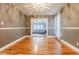 Neutral dining room features hardwood floors and views into bright living area with modern furniture at 5105 Davidson Ne Rd, Marietta, GA 30068