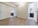 Hallway view with wood floors, showing the living room and bathroom access at 5105 Davidson Ne Rd, Marietta, GA 30068