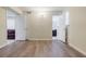 Bright hallway featuring wood floors, with doorways to the living room and bathroom at 5105 Davidson Ne Rd, Marietta, GA 30068