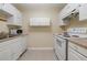 Cozy kitchen with white appliances and ample cabinet space for storage at 5105 Davidson Ne Rd, Marietta, GA 30068