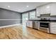 Bright kitchen featuring stainless appliances, ample counter space, and sliding door access to backyard at 5105 Davidson Ne Rd, Marietta, GA 30068