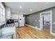 Well-lit kitchen with stainless sink, white cabinets, and hardwood floors at 5105 Davidson Ne Rd, Marietta, GA 30068