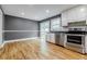 Bright kitchen featuring stainless appliances, ample counter space, and sliding door access to backyard at 5105 Davidson Ne Rd, Marietta, GA 30068