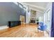 Bright living room featuring a stone fireplace, hardwood floors, and natural light at 5105 Davidson Ne Rd, Marietta, GA 30068