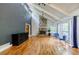 Bright living room with stone fireplace, hardwood floors, and high ceilings at 5105 Davidson Ne Rd, Marietta, GA 30068