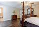 Lovely main bedroom with dark wood floors, and a door leading to another room at 5105 Davidson Ne Rd, Marietta, GA 30068