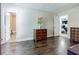 Bright main bedroom with rich wood floors, plus doorways to the bathroom and bedroom at 5105 Davidson Ne Rd, Marietta, GA 30068