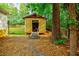 Backyard storage shed with a ramp for easy access, perfect for storing tools and garden equipment at 5105 Davidson Ne Rd, Marietta, GA 30068