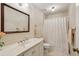Bathroom boasts a large mirror, toilet and shower at 1824 Mallard Lake Dr, Marietta, GA 30068