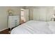 Bright bedroom features a white dresser, soft lighting, and a comfortable bed at 1824 Mallard Lake Dr, Marietta, GA 30068