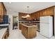 Spacious kitchen featuring custom wood cabinets, a functional center island, and modern appliances at 1824 Mallard Lake Dr, Marietta, GA 30068