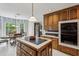 Bright kitchen/dining area features an island, stainless steel appliances, and window at 1824 Mallard Lake Dr, Marietta, GA 30068