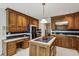Spacious eat-in kitchen features island, hardwood cabinets, and stainless steel appliances at 1824 Mallard Lake Dr, Marietta, GA 30068
