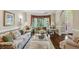Cozy living room features hardwood floors, a bay window, and comfortable floral-patterned sofas at 1824 Mallard Lake Dr, Marietta, GA 30068