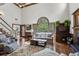 Spacious living room with a fireplace, large windows, hardwood floors, and comfortable seating at 1824 Mallard Lake Dr, Marietta, GA 30068