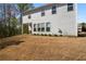 View of the backyard and the house's siding at 233 Hampton Station Blvd, Canton, GA 30115