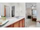 Bathroom with a view of bedroom, featuring a vanity with solid surface countertop at 233 Hampton Station Blvd, Canton, GA 30115