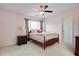 Cozy bedroom with a fan, comfortable bed, and ample natural light at 233 Hampton Station Blvd, Canton, GA 30115