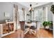 Cozy breakfast nook featuring a round table, elegant chandelier and views of the outdoors at 233 Hampton Station Blvd, Canton, GA 30115