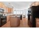 Modern kitchen with stainless steel appliances, granite countertops, and hardwood floors at 233 Hampton Station Blvd, Canton, GA 30115
