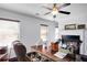Bright home office with a fireplace, built-ins, and a comfortable workspace at 233 Hampton Station Blvd, Canton, GA 30115