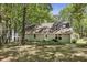 Enjoy this home with a private, large, and wooded backyard with patio and grill at 1390 Barclay Dr, Lawrenceville, GA 30043