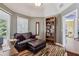 Cozy bedroom with chair rail molding, a large window for natural light, and a walk in closet at 1390 Barclay Dr, Lawrenceville, GA 30043
