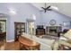 Cozy living room with stone fireplace, hardwood floors, high ceilings, and a skylight at 1390 Barclay Dr, Lawrenceville, GA 30043