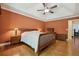Comfortable bedroom with tray ceiling, hardwood floors, and ample space for furniture at 1390 Barclay Dr, Lawrenceville, GA 30043