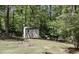 The large backyard features a storage shed at 1390 Barclay Dr, Lawrenceville, GA 30043