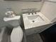 Bathroom with marble vanity top, updated fixtures, and modern commode at 1900 Meadow Ln, Decatur, GA 30032