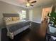 Bedroom with queen bed, dark hardwood floors, large windows and neutral colored walls at 1900 Meadow Ln, Decatur, GA 30032