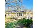 Exterior view of charming home featuring lawn and blue skies at 1900 Meadow Ln, Decatur, GA 30032