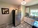Bright kitchen features stainless steel appliances and stylish black and white patterned flooring at 1900 Meadow Ln, Decatur, GA 30032