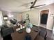 Open concept living room and dining area featuring stylish furniture, modern fan, and elegant decor at 1900 Meadow Ln, Decatur, GA 30032