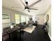 Bright living room with dark wood floors, neutral walls, and large windows that flood the space with natural light at 1900 Meadow Ln, Decatur, GA 30032
